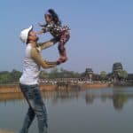 Father with child in front of Angkor Wat - Siem Reap, Cambodia