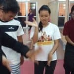 Phare Circus dancer teaches traditional Cambodian dance moves
