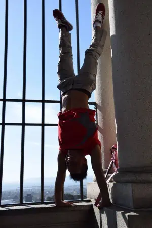 Phare Circus performer does handstand while touring the United States