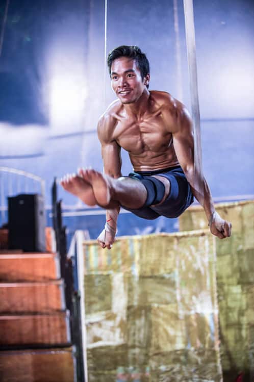 Performer Ratha Bo rehearsing with aerial straps at Phare, The Cambodian Circus
