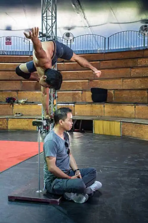 Scott_Sharick_Photo__2015_32112_optPerformer Ratha Bo does handstand on balance sticks at Phare Circus for Japanese director Amon Miyamoto