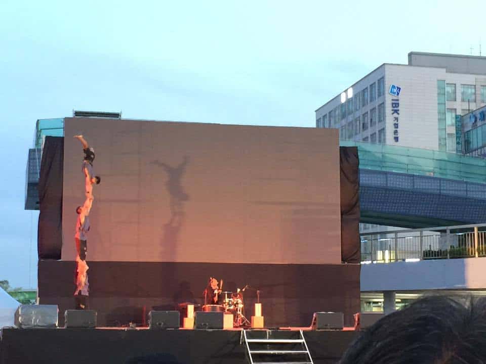 Phare Circus human tower on outdoor stage