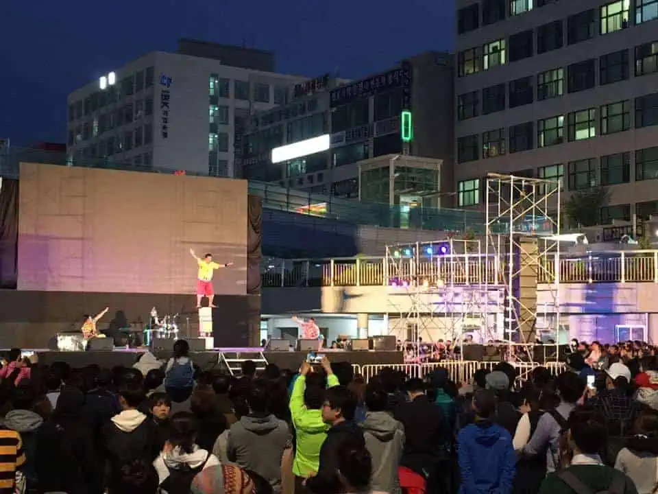 Phare Circus performs on outdoor stage to audience in Korea