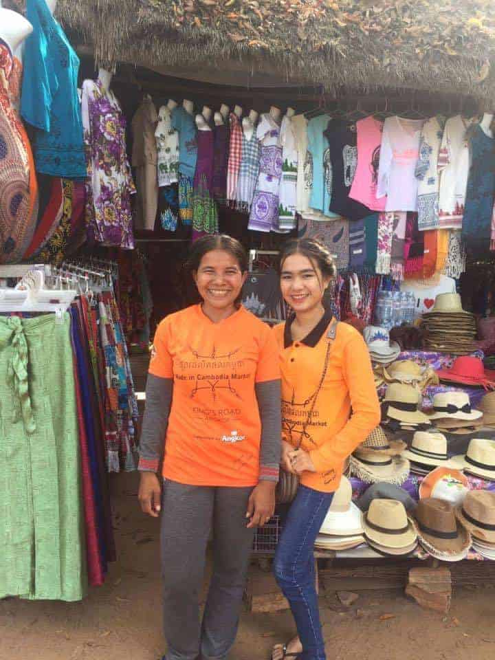 Responsible tourism - Locally made goods at Made in Cambodian Market - two women standing in front of stall