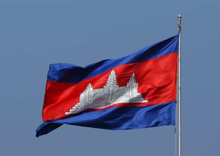 Cambodian flag on flag pole waiving in the wind
