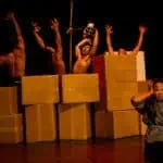 Phare Circus live show "Sokha" - Cambodian symbolism - men being tortured by man in black costume and skull mask, woman in anguish