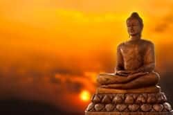 Golden Buddha with sunset background