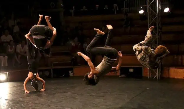 Phare Circus live show "The Adventure" - acrobats flip and do handstand on stage