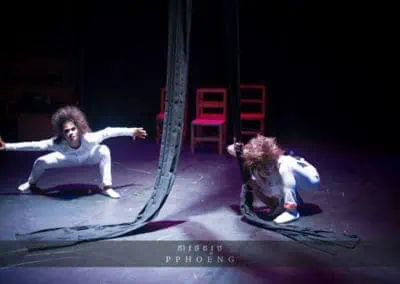 Phare Circus performance "Chills": 2 aerial silk performers in ghost costume and makeup haunting the stage