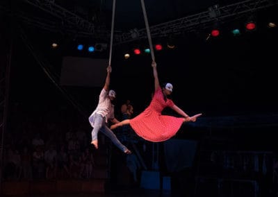 Phare Circus show "Same Same But Different": male and female perform duet with aerial straps above stage