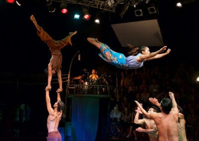 Phare Circus show "Same Same But Different" - cultural differences: female actobat flying to be caught by other performers