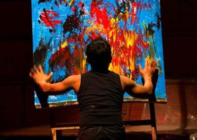 Phare Circus show "Sokha" surviving Khmer Rouge: visual artist doing live painting representing bombing and chaos of Khmer Rouge
