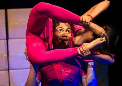 Phare Circus show "Sokha": male dancer holds female contortionist at his shoulders