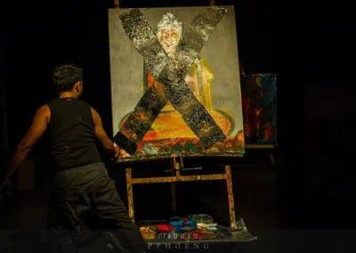 Phare Circus show "Sokha": visual artist live painting the destruction of a Buddha , war destroying art