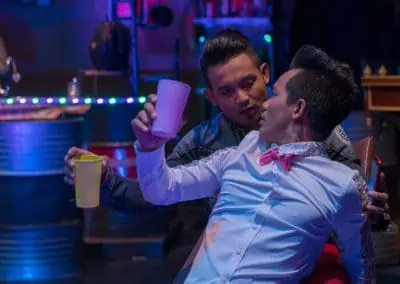 Phare Circus performance "Khmer Metal": male bar patrons begin to flirt with each other