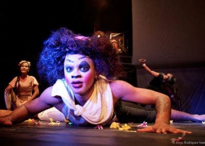 Phare Circus show "Tchamlaek": clown crawling on floor with dramatic facial expression