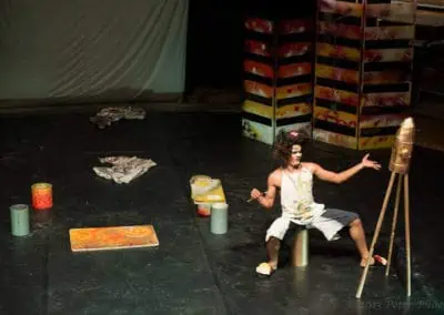 Phare Circus performance "Tchamlaek": clown with rolla bolla and painting an imaginary rocket