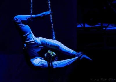 Phare Circus show "Tchamlaek": female contortionist performing on aerial ropes above circus stage