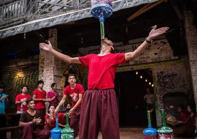 Phare Circus's Tini Tinou International Circus Festival (2016) - perfomer balances water jugs on his chin