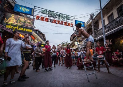 Phare Circus's Tini Tinou International Circus Festival (2016) - circus clown in diaper on ladder in Pub Street