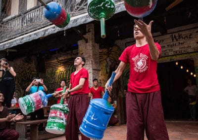 Phare Circus's Tini Tinou International Circus Festival (2016) - performers juggling water jugs on sticks