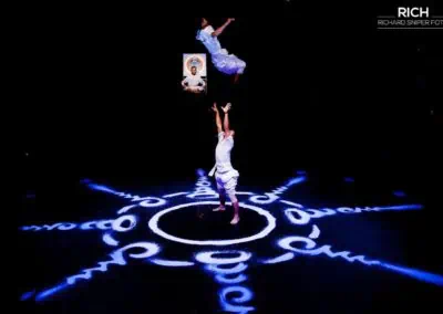 Phare Circus live show "White Gold" - hand-to-hand acrobatics over Buddhist mandala design created with rice
